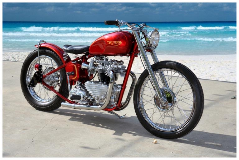 candy-apple-red-Triumph-bobber-at-the-beach.jpg